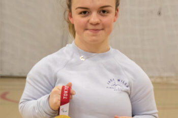 Maisie Summers-Newton, Athelete and Paralympic champion holding 2 gold medals